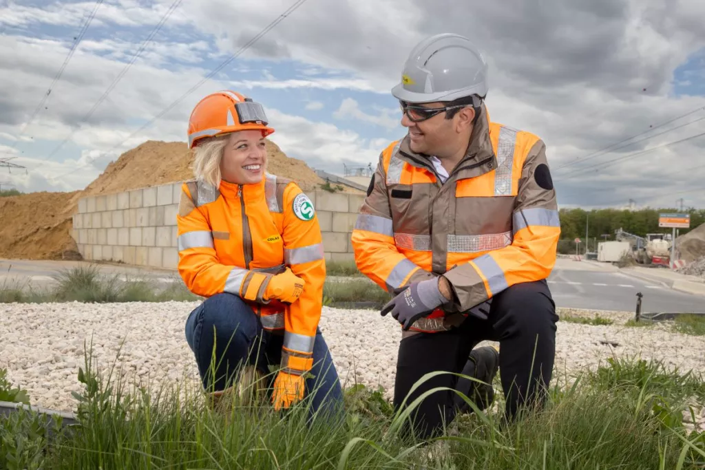 Colas team members discussing on a recycling platform