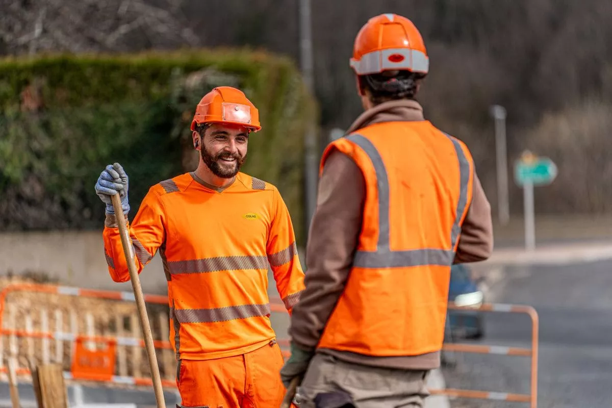 Colas team members laughing together