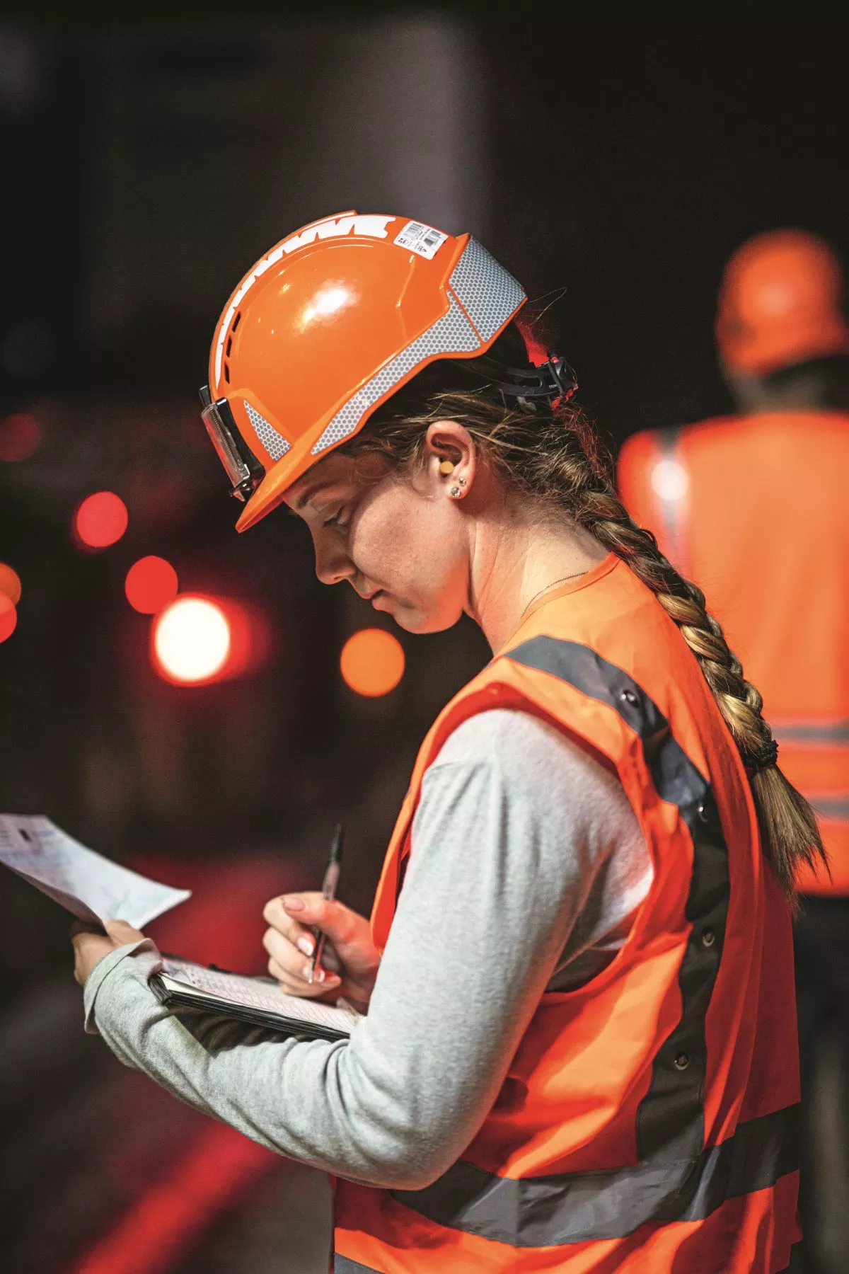 olas employee on a night-time construction site